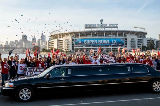 People celeberating around a limo due o the super bowl 2026